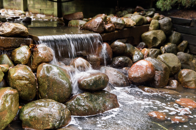 Rocks with a fountain.